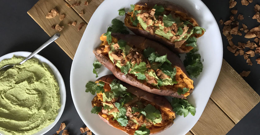 Loaded Sweet Potatoes with Cilantro-Jalapeno Hummus and Coconut Flake “Bacon” Bits Recipe